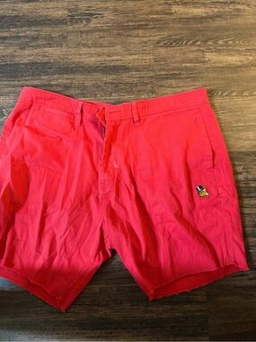 Authentic Akoo Men's Red Casual Shorts with Embroidered Mascot
